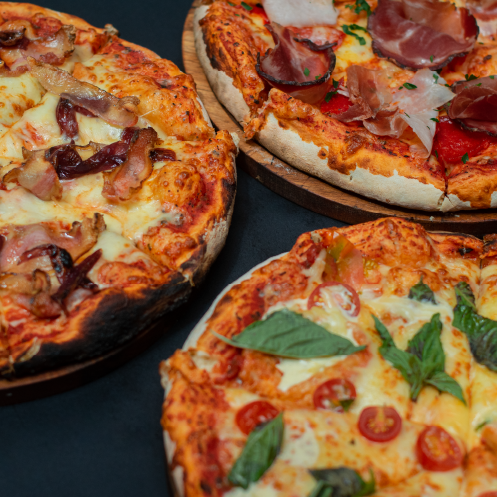 Tres de nuestras pizzas en nuestro all you can eat de pizza en Bogotá